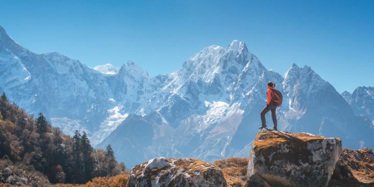 Female hiker looking towards mountains