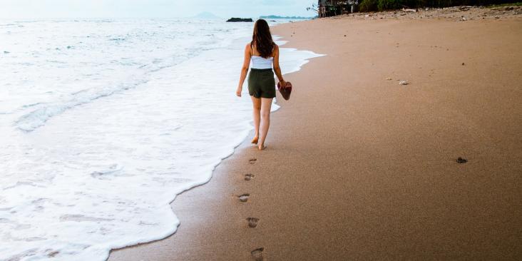 Woman walking on beach
