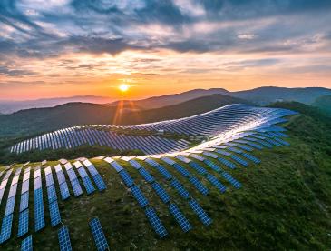 Solar panel installation on mountains with sunrise